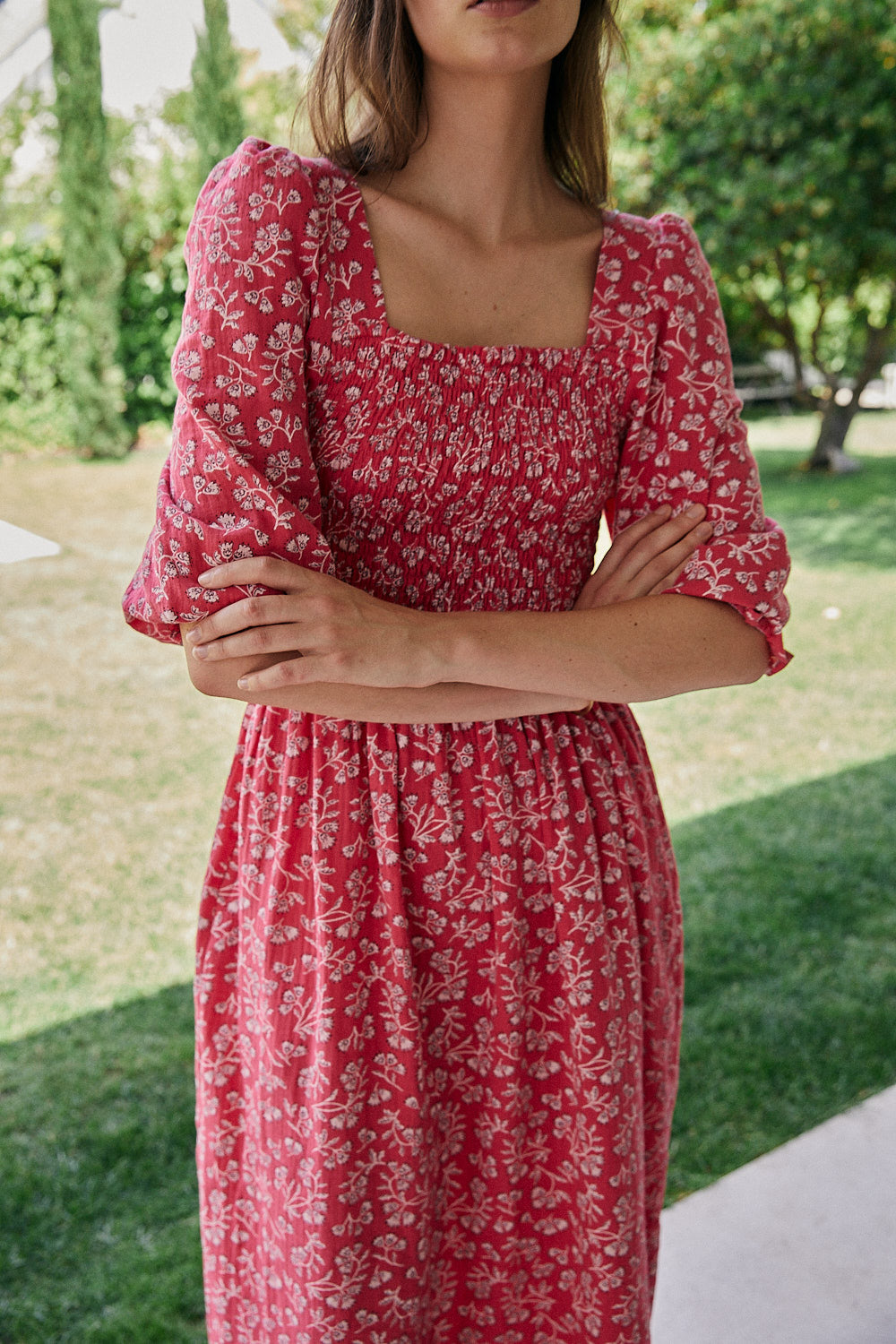 FRIDA dress with white flowers and fuchsia background