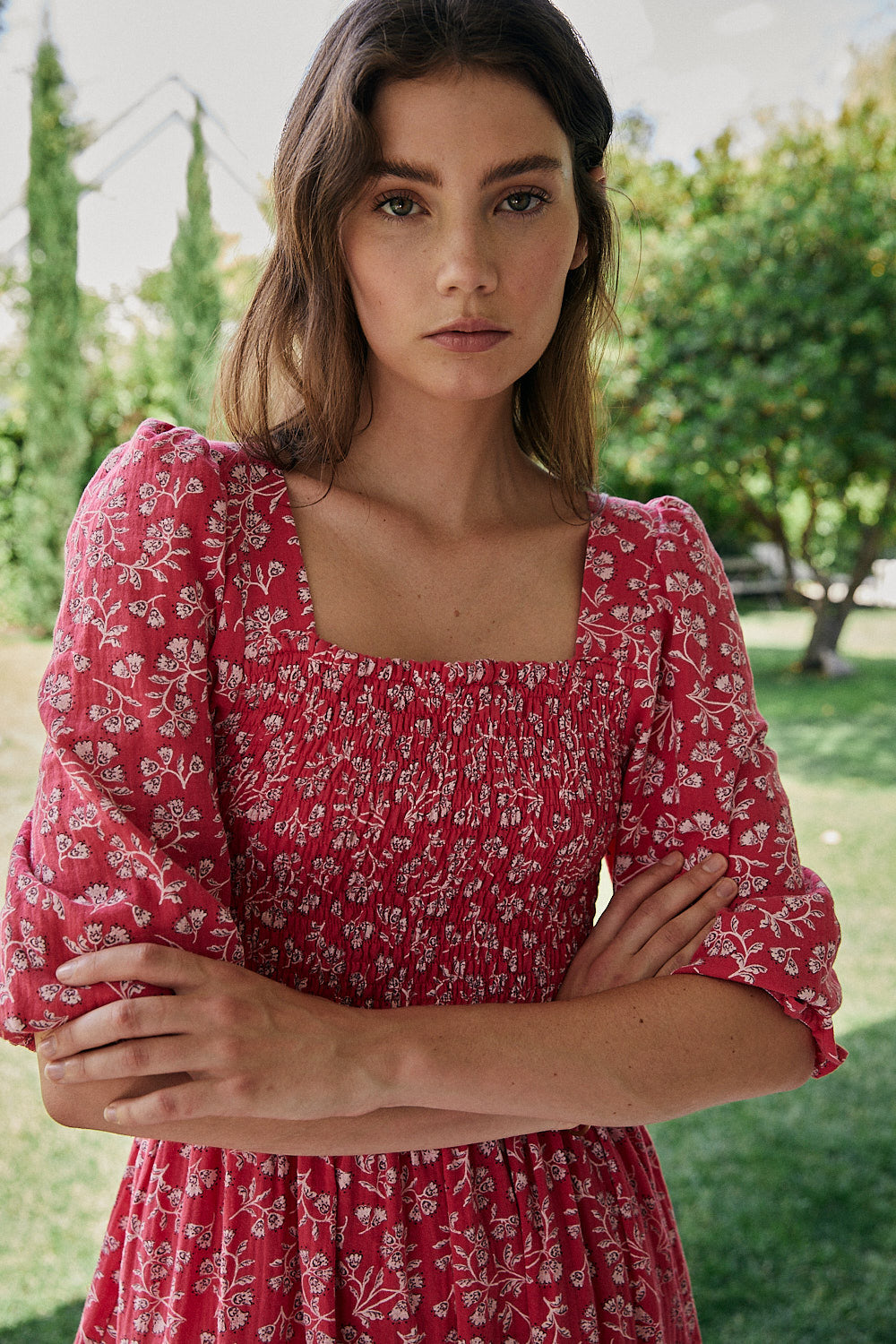 FRIDA dress with white flowers and fuchsia background