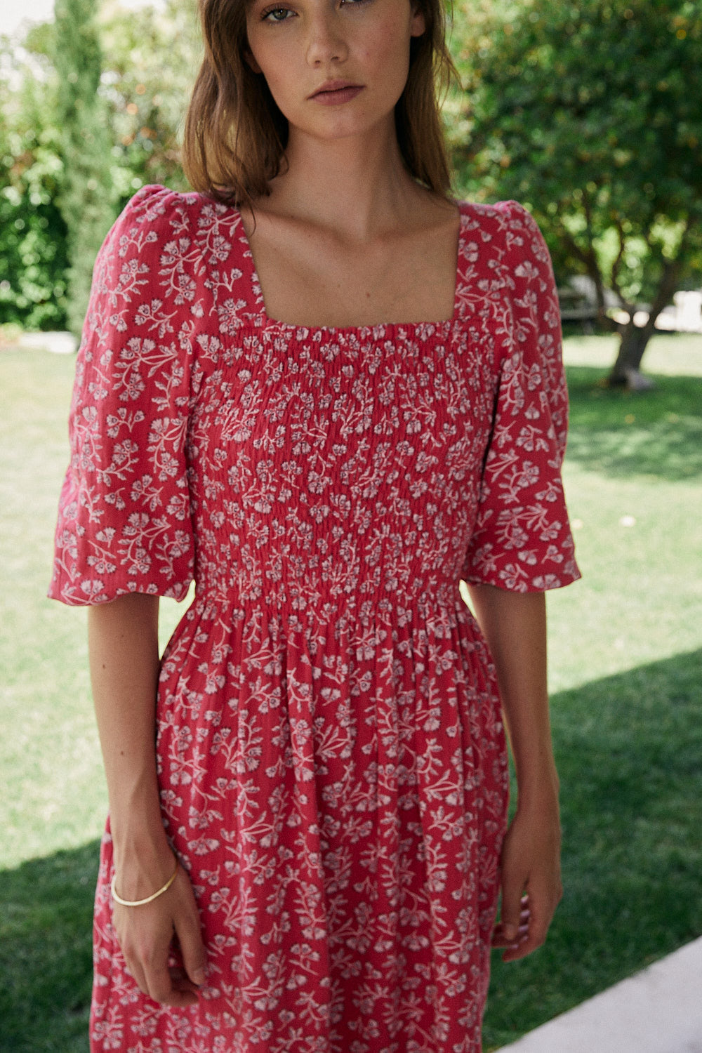 FRIDA dress with white flowers and fuchsia background